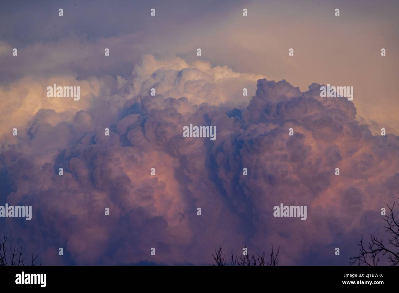 A shot of a huge clouds in the sky in the sunset time Stock Photo - Alamy