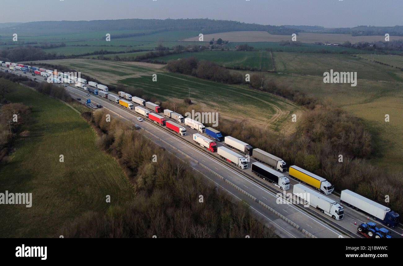 A view of lorries queued in Operation Brock on the M20 near Ashford in Kent as freight delays continue at the Port of Dover where P&O ferry services remain suspended. Picture date: Thursday March 24, 2022. Stock Photo