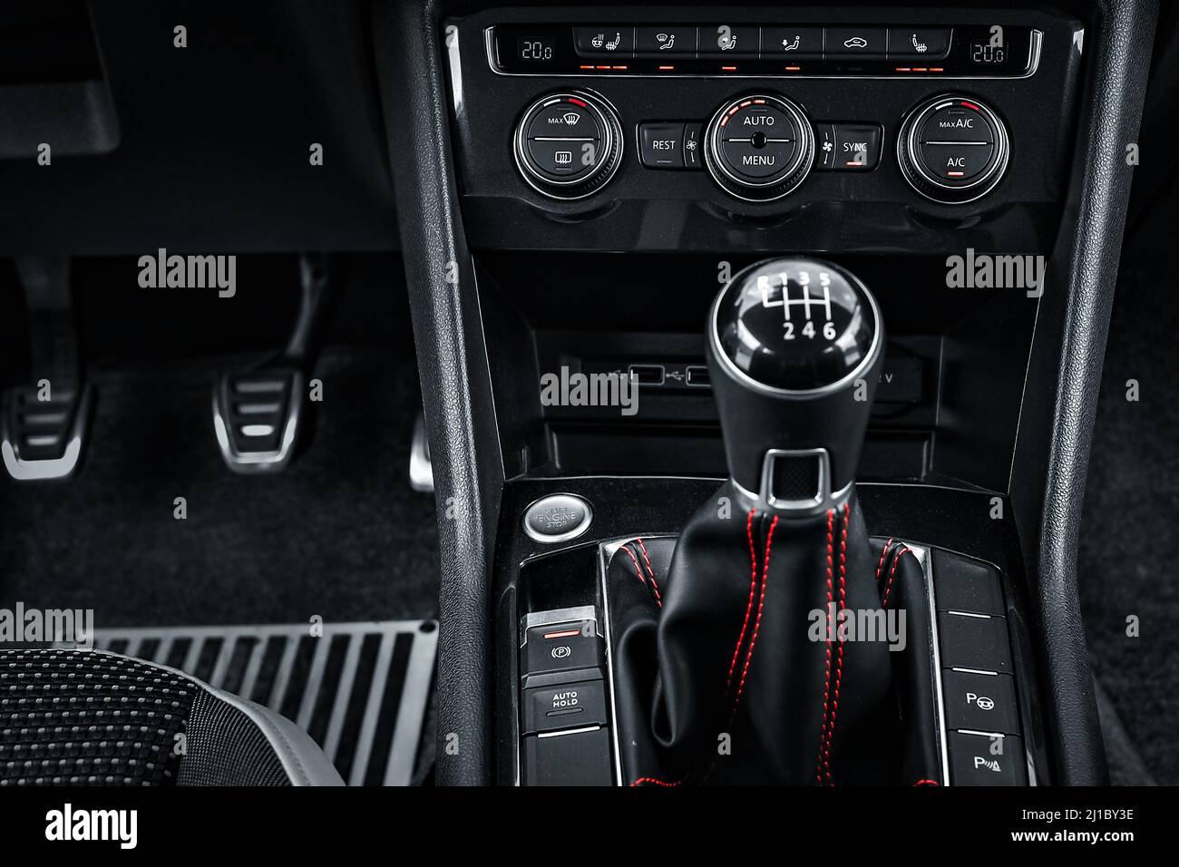 Interior of car. Lever of manual transmission in cabin of car is close-up. Dark style. Background Stock Photo