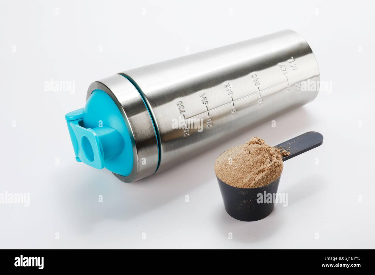 Metal shaker and scoop with protein powder Stock Photo Alamy