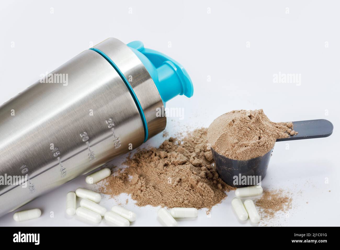 Shaker, scoop with protein powder and pills Stock Photo Alamy