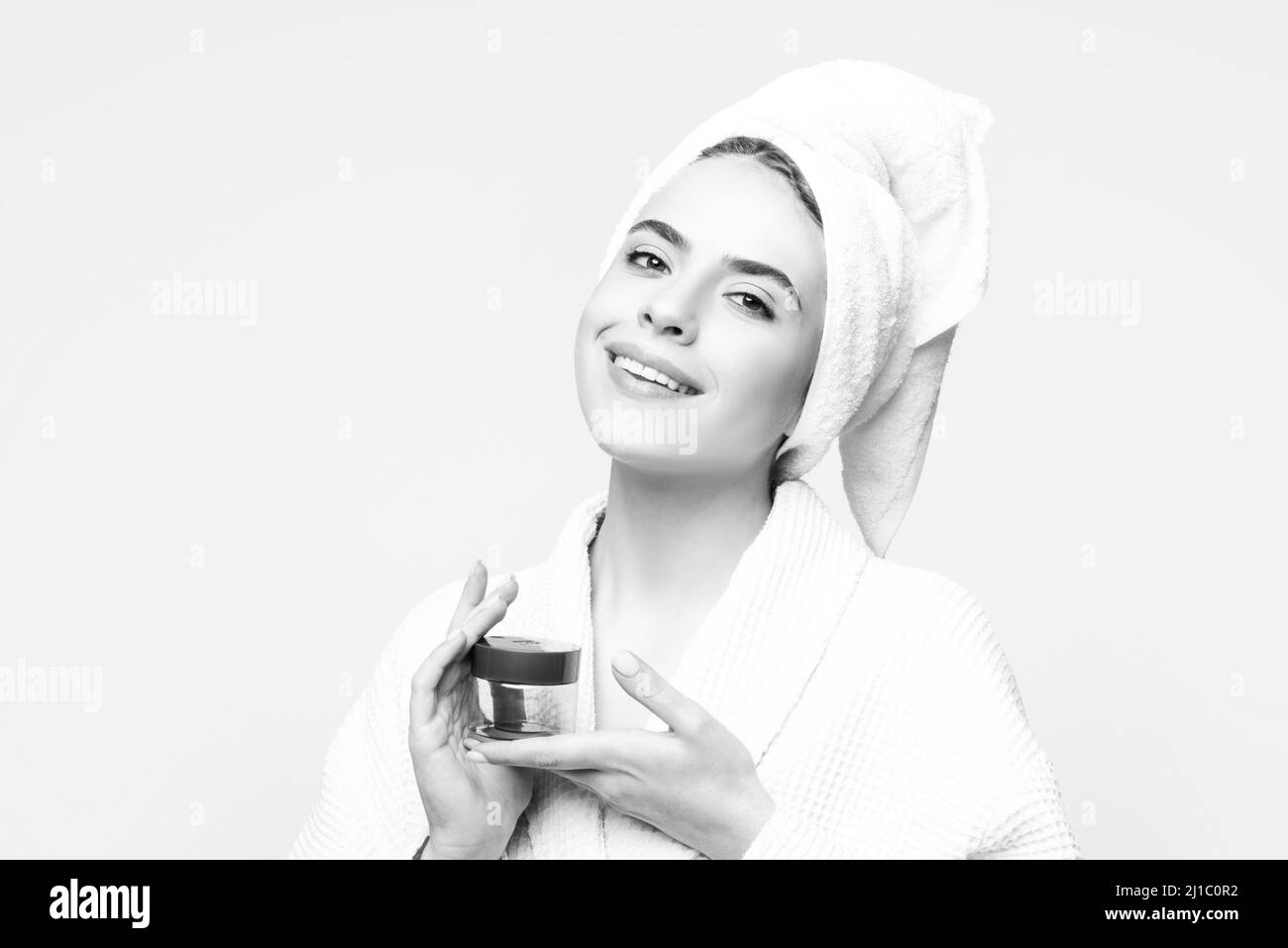 Facial treatment. Happy woman proposing a cosmetics product. Gestures ...