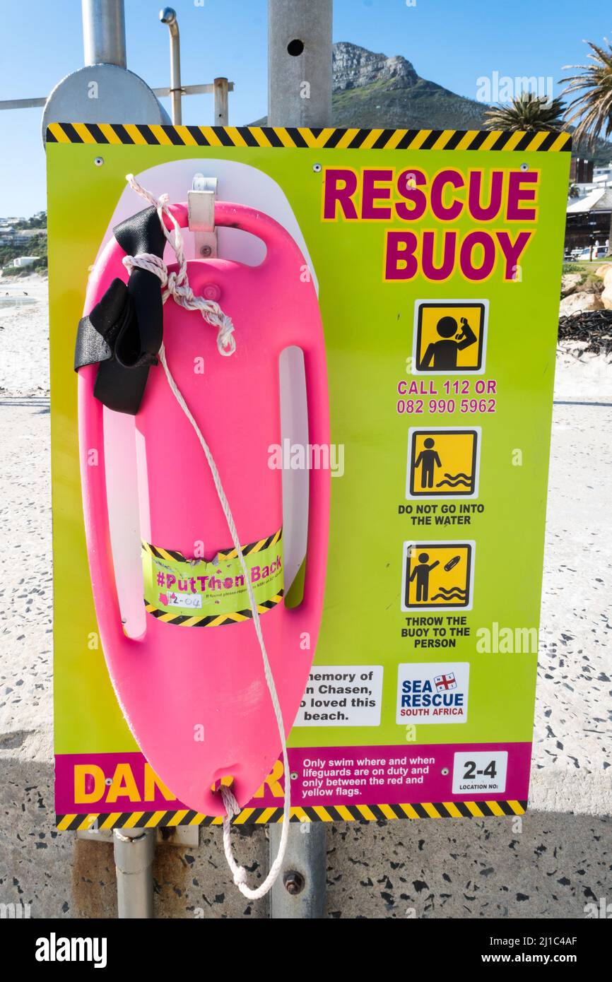 rescue buoy or life saving equipment on a sign board with instructions