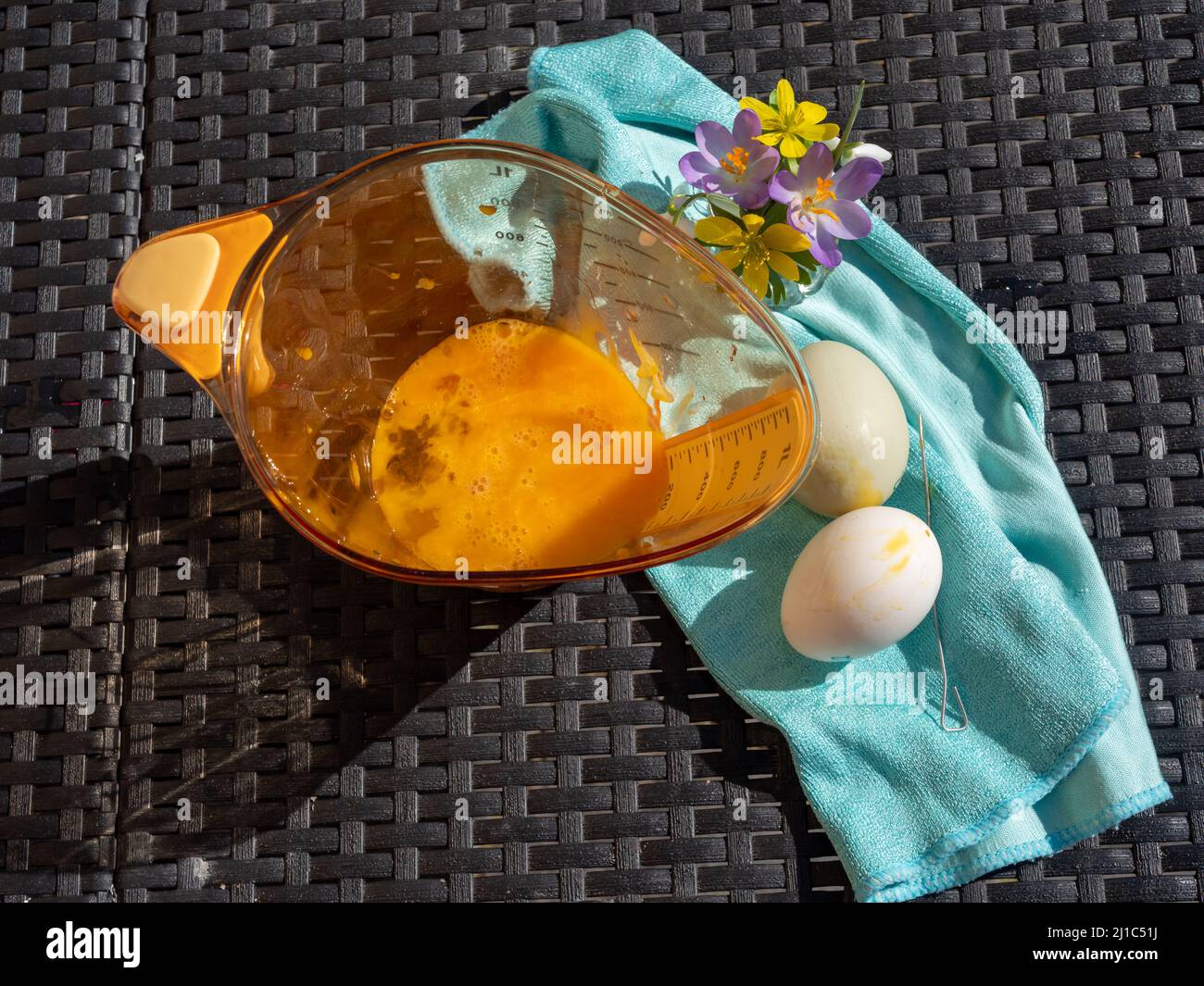 Blowing out eggs at Easter time Stock Photo