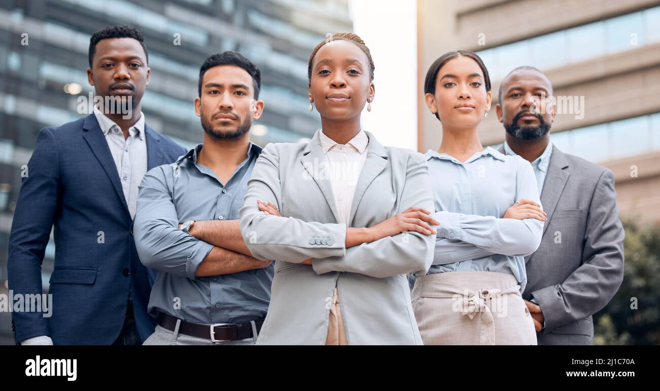No one can take us down. Shot of a group of businesspeople standing outside together. Stock Photo