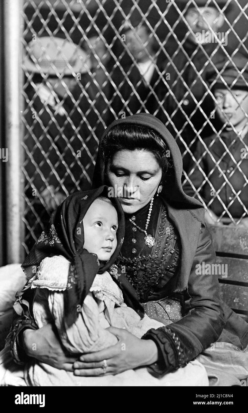 Mother and Child at Ellis Island by Lewis Hine, c. 1908 Stock Photo