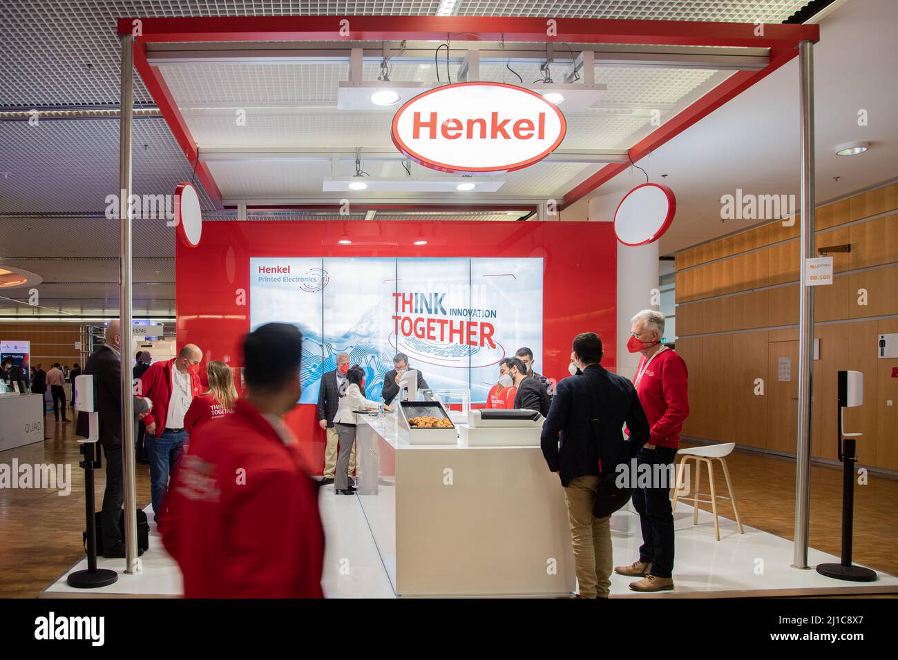 Munich, Germany. 24th Mar, 2022. Stand of Henkel at the Lopec trade fair on March 24, 2022 in Munich, Germany. The LOPEC is a yearly hold trade fair for organic and printed electrinics. (Photo by Alexander Pohl/Sipa USA) Credit: Sipa USA/Alamy Live News Stock Photo