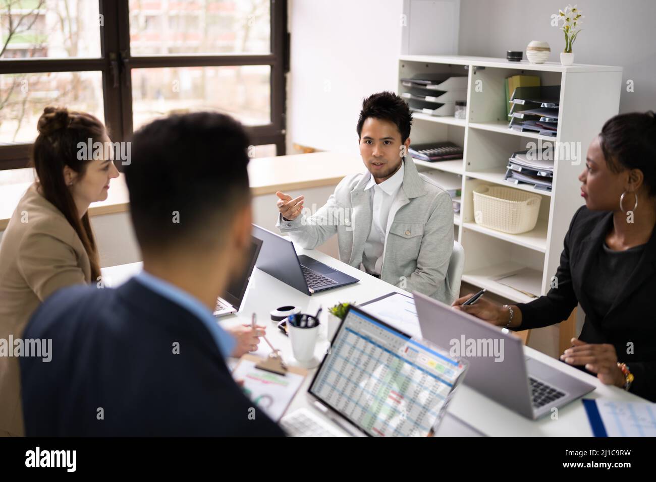 Diverse Business People Group At Workplace. Staff Meeting Stock Photo