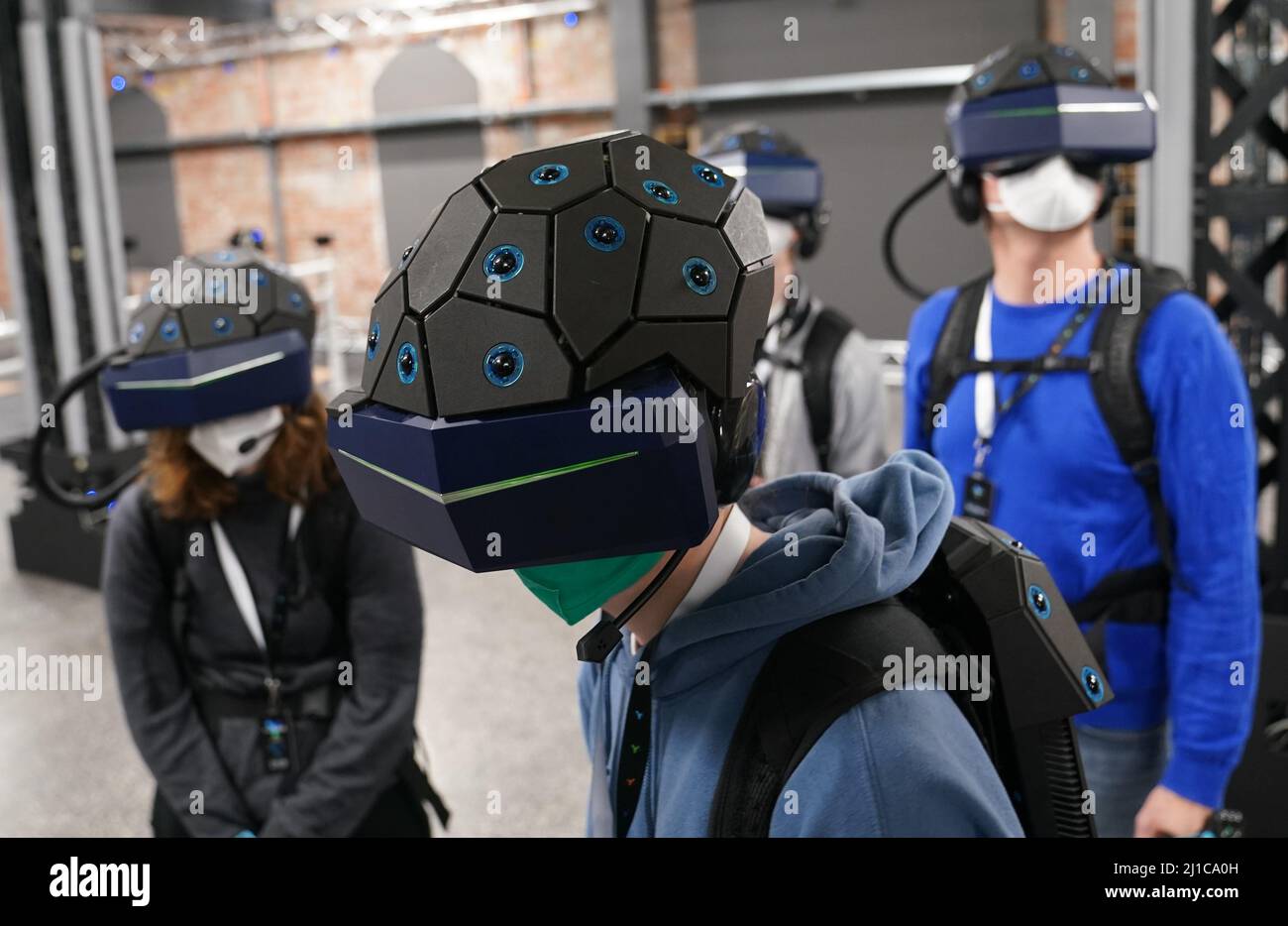 24 March 2022, Hamburg Media representatives and visitors stand with