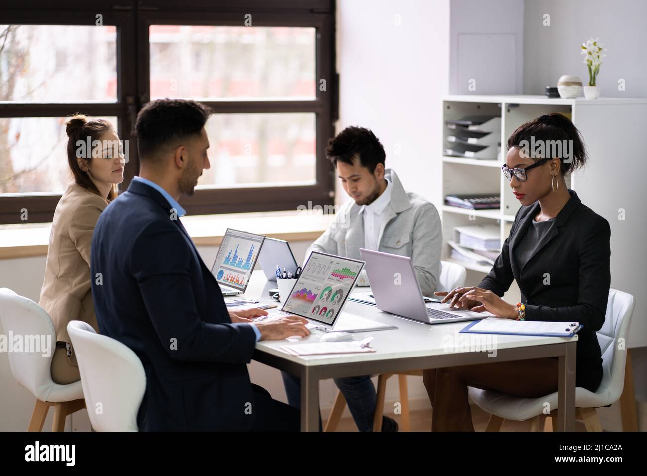 Diverse Business People Discussions In Office. Group Meeting Stock Photo
