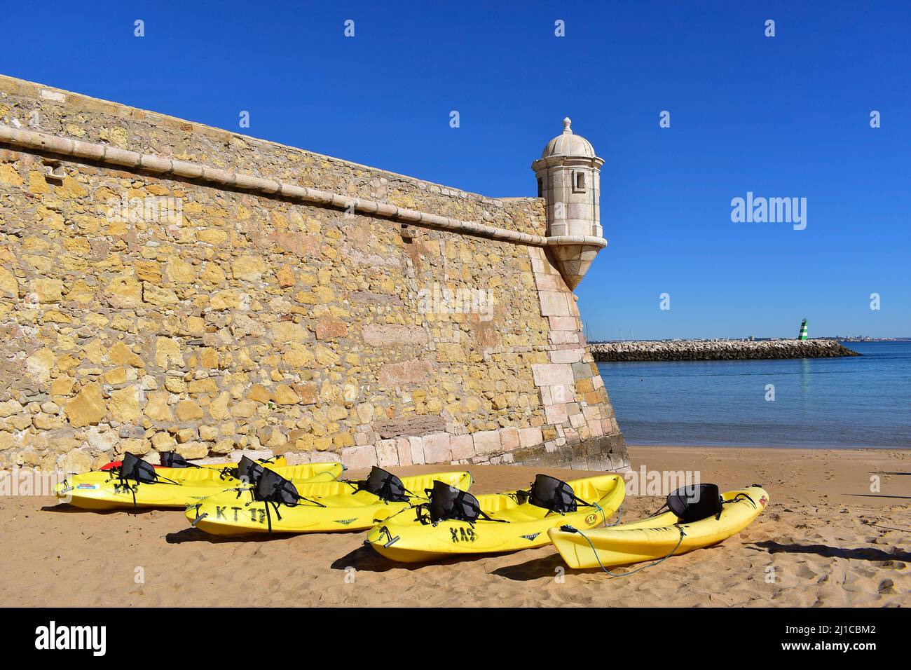 Yellow kayaks on the beach ready for an excursion out on the ocean, Lagos fortress, Algarve, Portugal, Europe Stock Photo