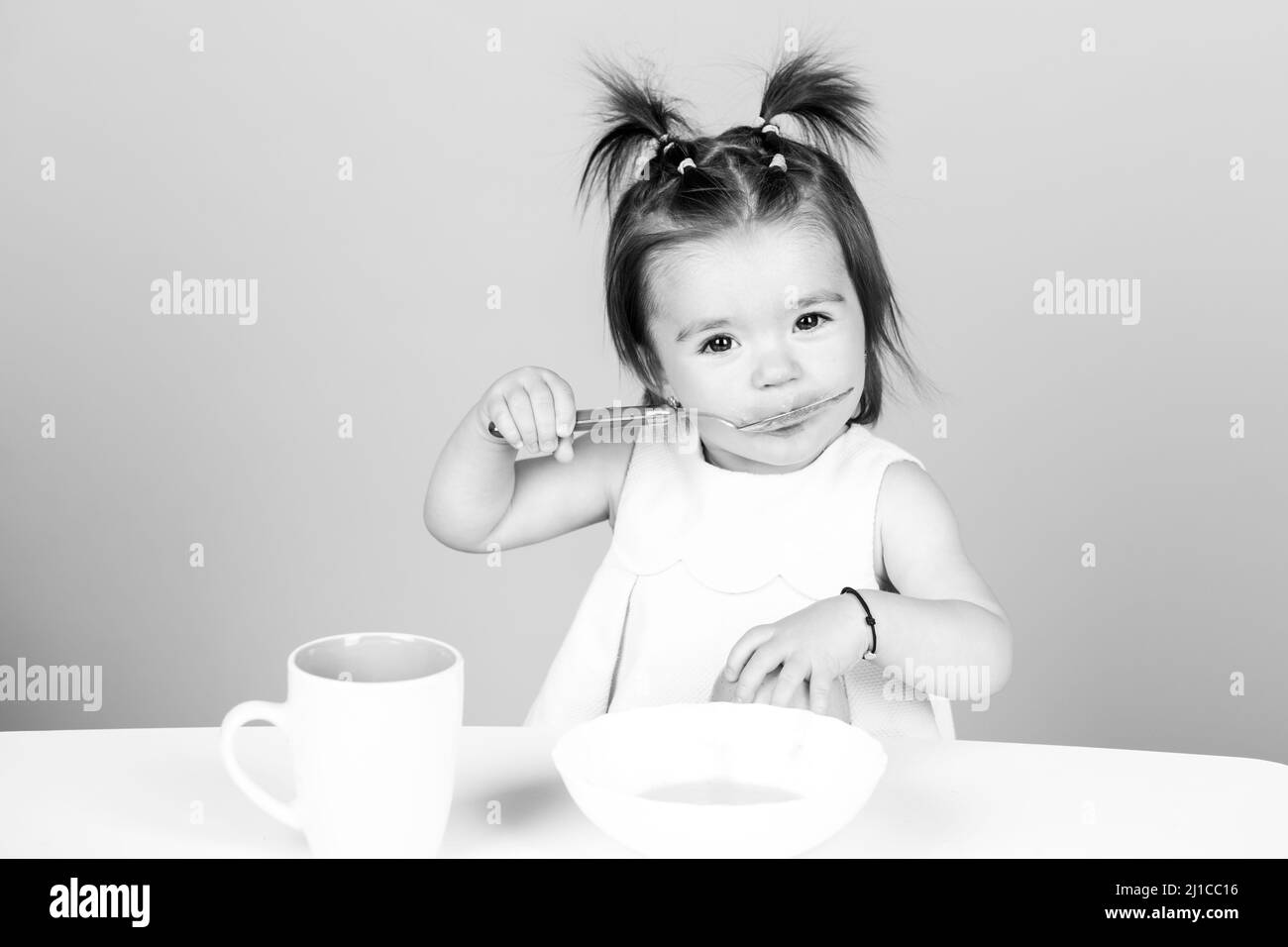 Babies eating, healthy food for a baby. Little baby eating fruit puree