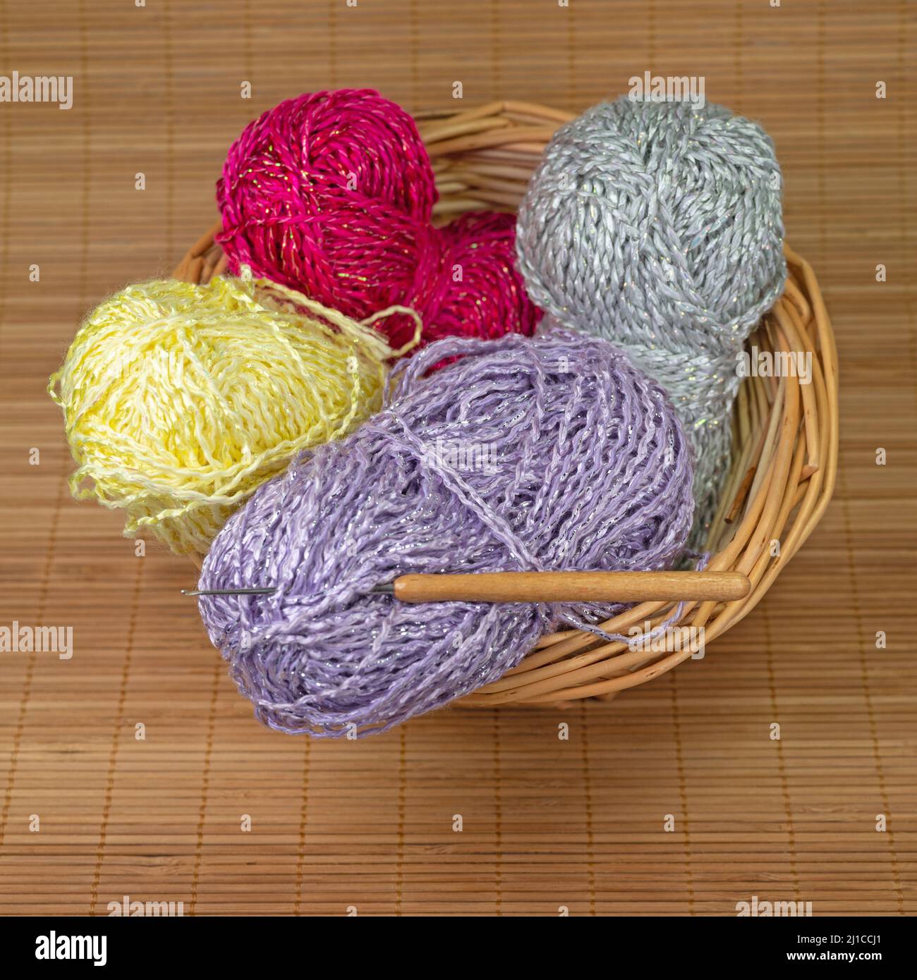 Colorful crochet yarns in a basket Stock Photo