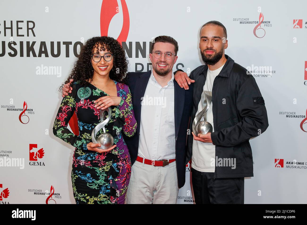 Berlin, Germany. 24th Mar, 2022. The producer team Suena and Lucry wins the award in the category 'Hip-Hop' stand with Prinz Pi (M) at the 13th German Music Authors Award ceremony at the Ritz-Carlton Hotel. Credit: Gerald Matzka/dpa/Alamy Live News Stock Photo