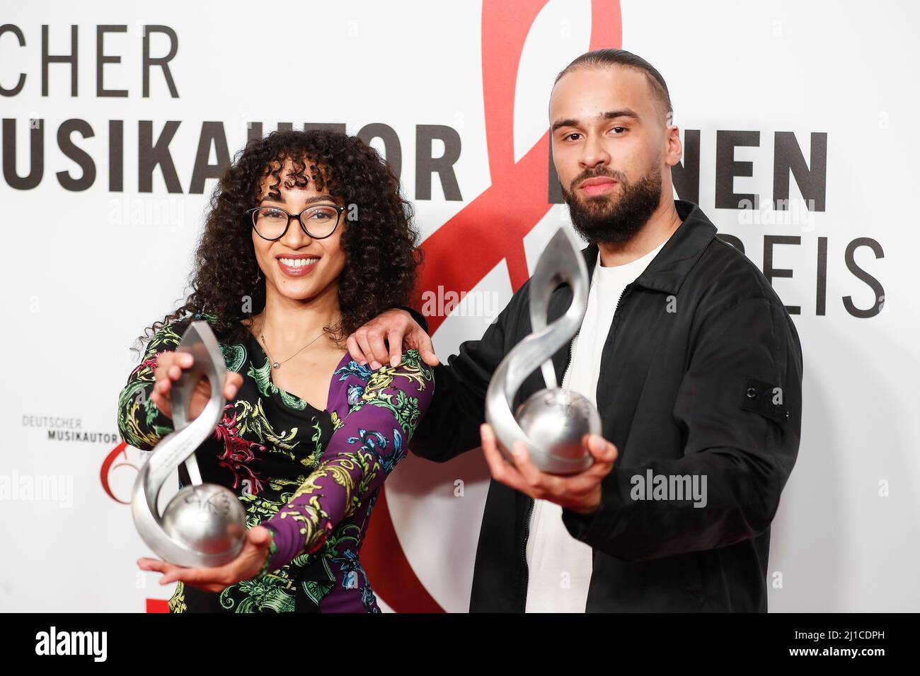 Berlin, Germany. 24th Mar, 2022. The producer team Suena and Lucry wins the award in the category 'Hip-Hop' at the 13th German Music Authors Award ceremony at the Ritz-Carlton Hotel. Credit: Gerald Matzka/dpa/Alamy Live News Stock Photo