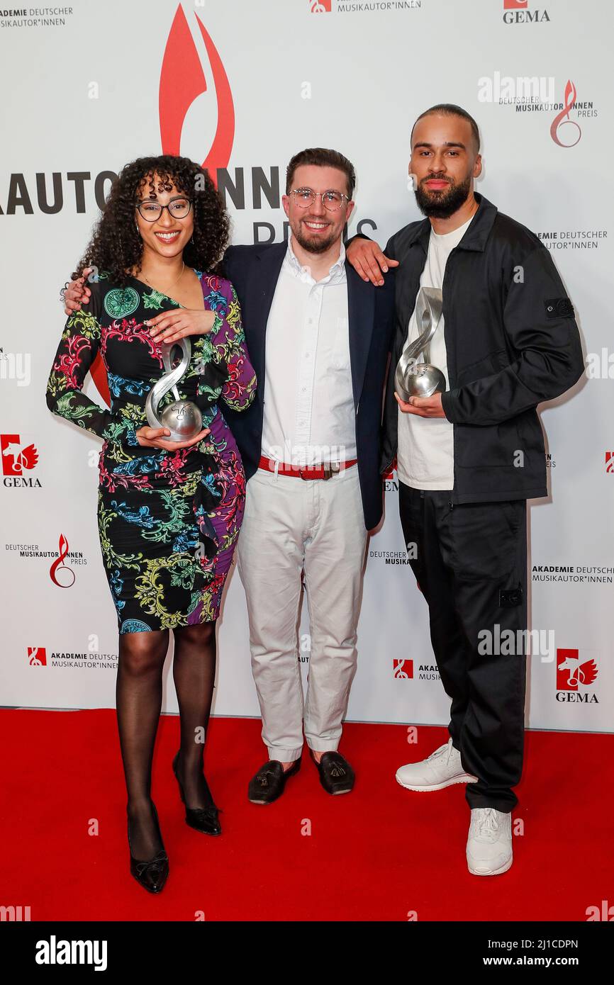 Berlin, Germany. 24th Mar, 2022. The producer team Suena and Lucry wins the award in the category "Hip-Hop" stand with Prinz Pi (M) at the 13th German Music Authors Award ceremony at the Ritz-Carlton Hotel. Credit: Gerald Matzka/dpa/Alamy Live News Stock Photo