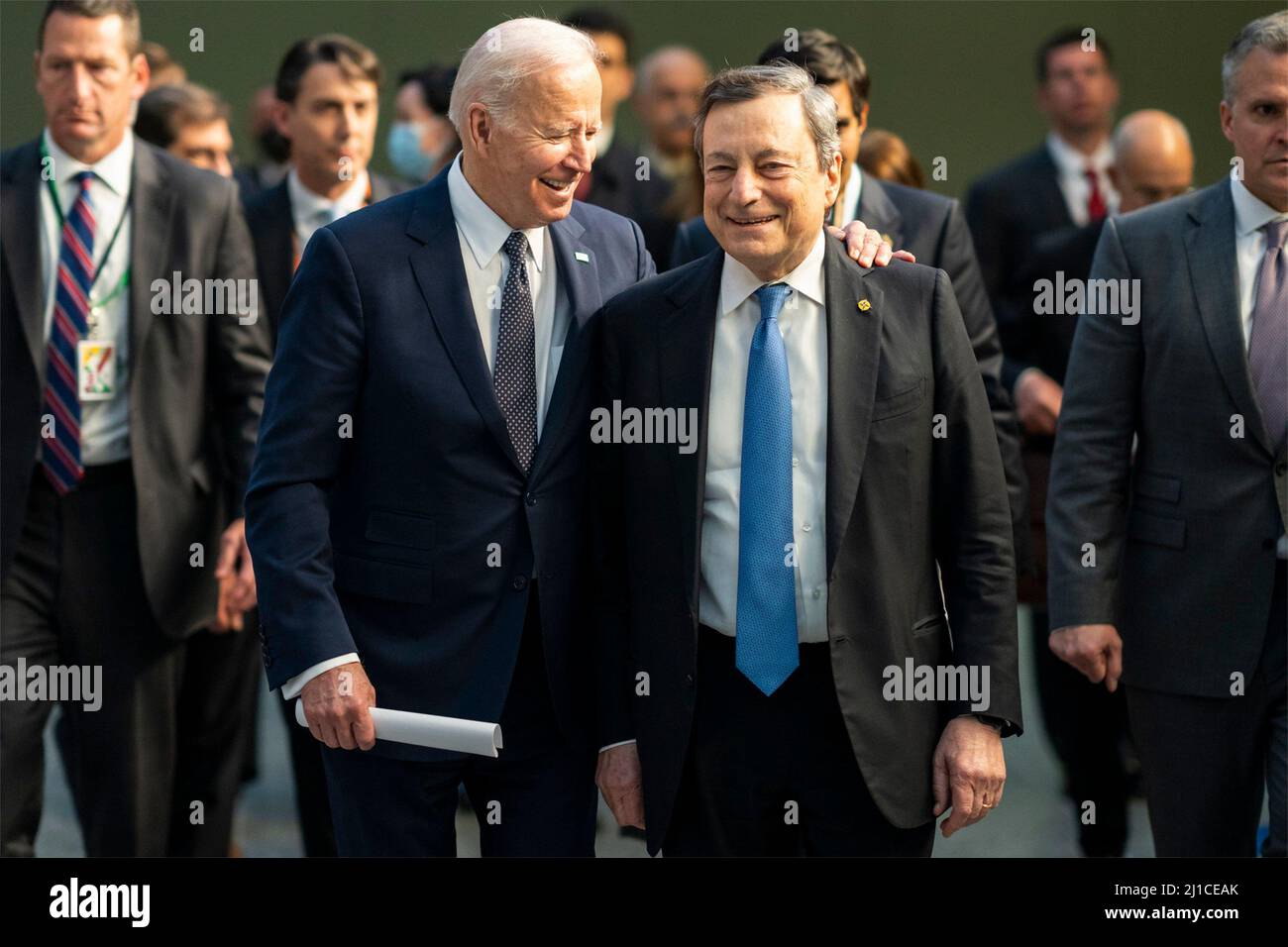 Brussels, Belgium. 24th Mar, 2022. U.S President Joe Biden, walks with Italian Prime Minister Mario Draghi, right, during the emergency meeting of the G7 nations at NATO headquarters, March 24, 2022 in Brussels, Belgium. Biden is hoping allied nations will continue to ramp up pressure on Russia as Ukraine marks a month since the invasion. Credit: Adam Schultz/White House Photo/Alamy Live News Stock Photo