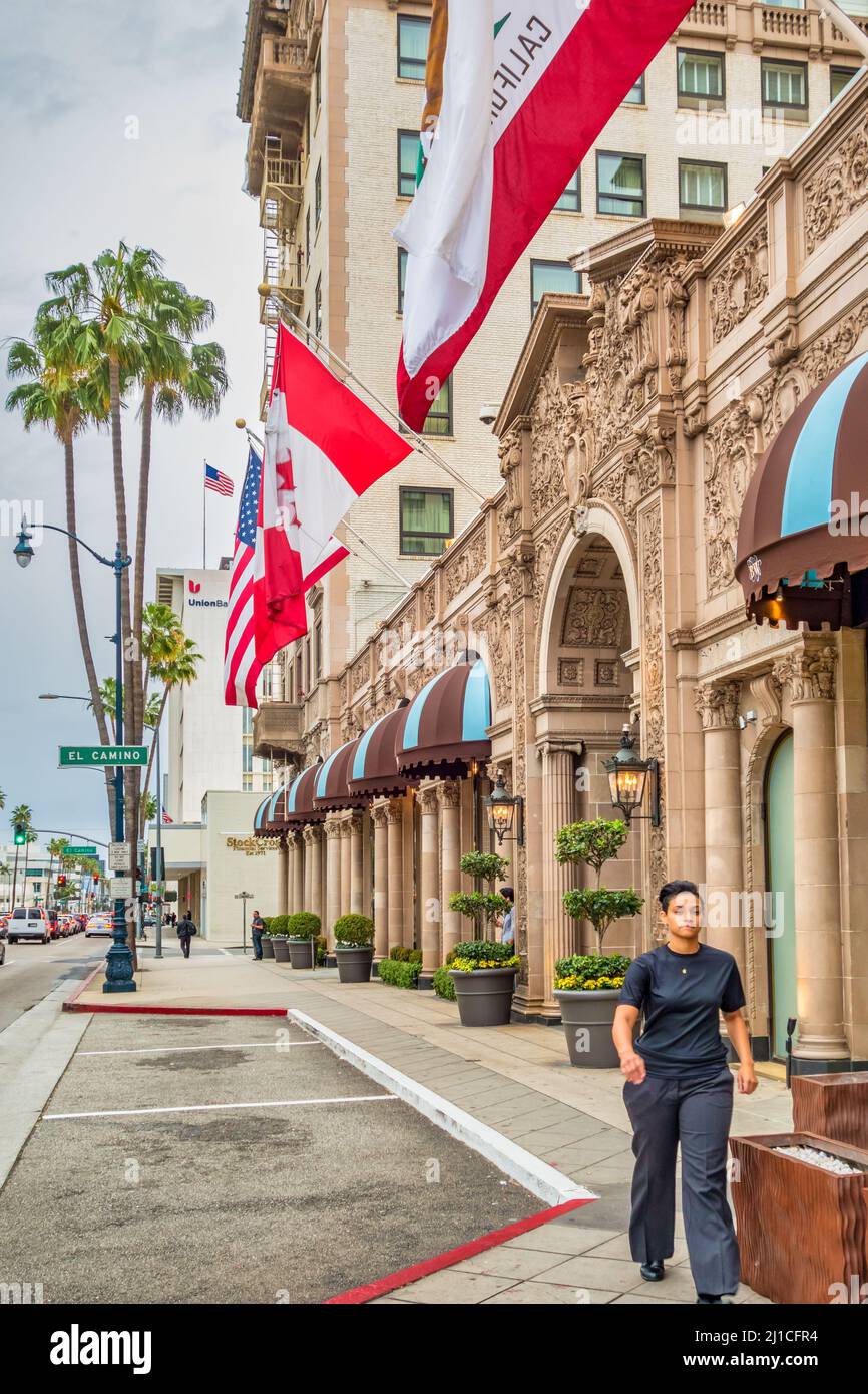 Pedestrian walks at the Beverly Wilshire Hotel on Wilshire Boulevard in Beverly Hills, Los Angeles California USA. Stock Photo