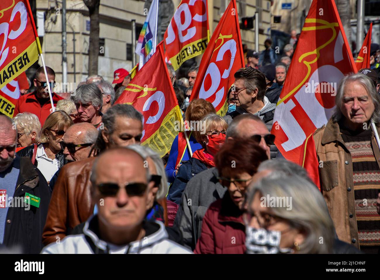 Marseille, France. 24th Mar, 2022. Protesters march with flags during the demonstration. Retirees have held protests in some 20 towns across France to demand higher pensions and better access to health care services. The protests started three weeks before the French presidential election, with the first round taking place on April 10, 2022. (Photo by Gerard Bottino/SOPA Images/Sipa USA) Credit: Sipa USA/Alamy Live News Stock Photo