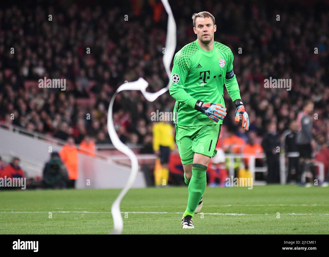 LONDON, ENGLAND - MARCH 7, 2017: Manuel Neuer cleans the pitch after Bayern ultras thrown paper rolls during the second leg of the UEFA Champions League Round of 16 game between Arsenal FC and Bayern Munchen at Emirates Stadium. Copyright: Cosmin Iftode/Picstaff Stock Photo