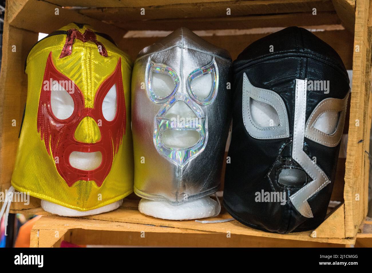Lucha libre wrestling masks of three famous Mexican wrestlers for sale in a market in Brownsville, Texas. Stock Photo