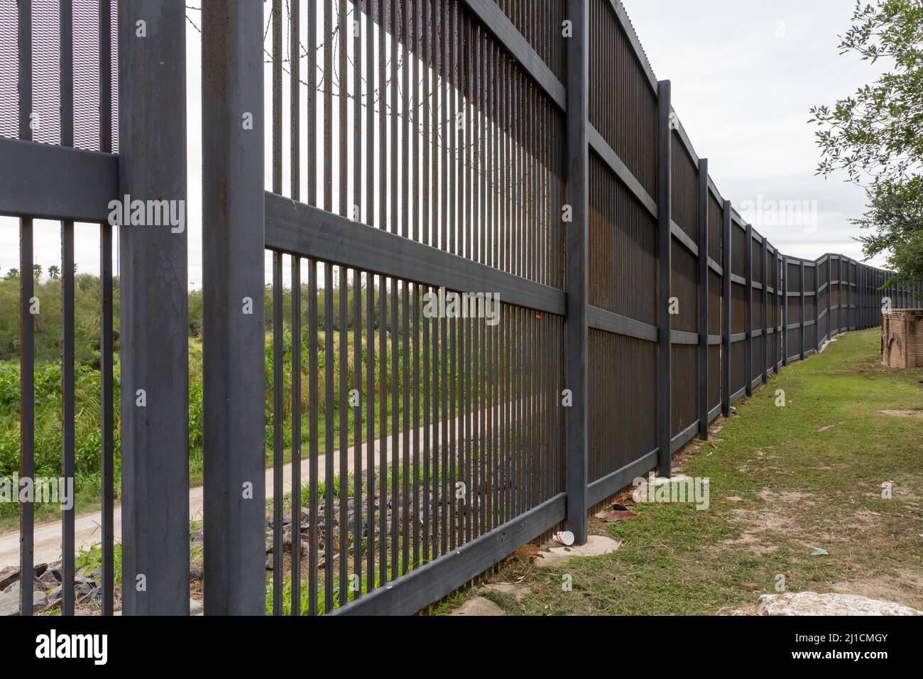 The U.S. - Mexico border wall in Brownsville, Texas.  Viewed from Texas side of the wall. Stock Photo