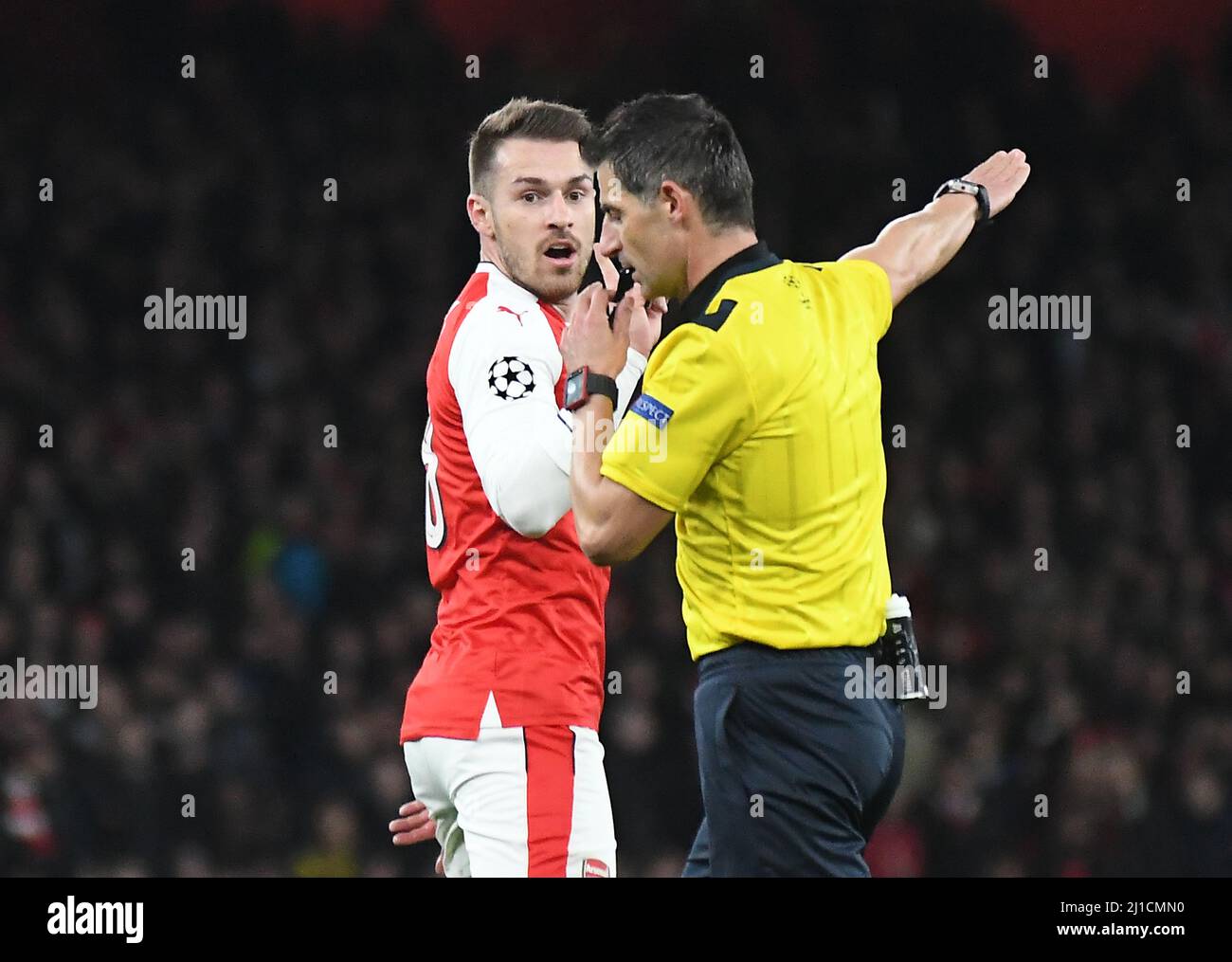 LONDON, ENGLAND - MARCH 7, 2017: Aaron Ramsey (L) of Arsenal reacts after a decision of the Greek FIFA referee Tasos Sidiropoulos during the second leg of the UEFA Champions League Round of 16 game between Arsenal FC and Bayern Munchen at Emirates Stadium. Copyright: Cosmin Iftode/Picstaff Stock Photo