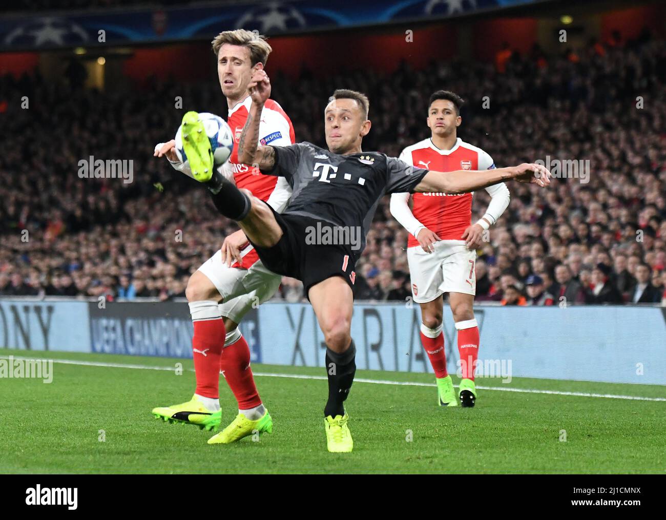 LONDON, ENGLAND - MARCH 7, 2017: Nacho Monreal (L) of Arsenal and Rafinha (R) of Bayern pictured in action during the second leg of the UEFA Champions League Round of 16 game between Arsenal FC and Bayern Munchen at Emirates Stadium. Copyright: Cosmin Iftode/Picstaff Stock Photo