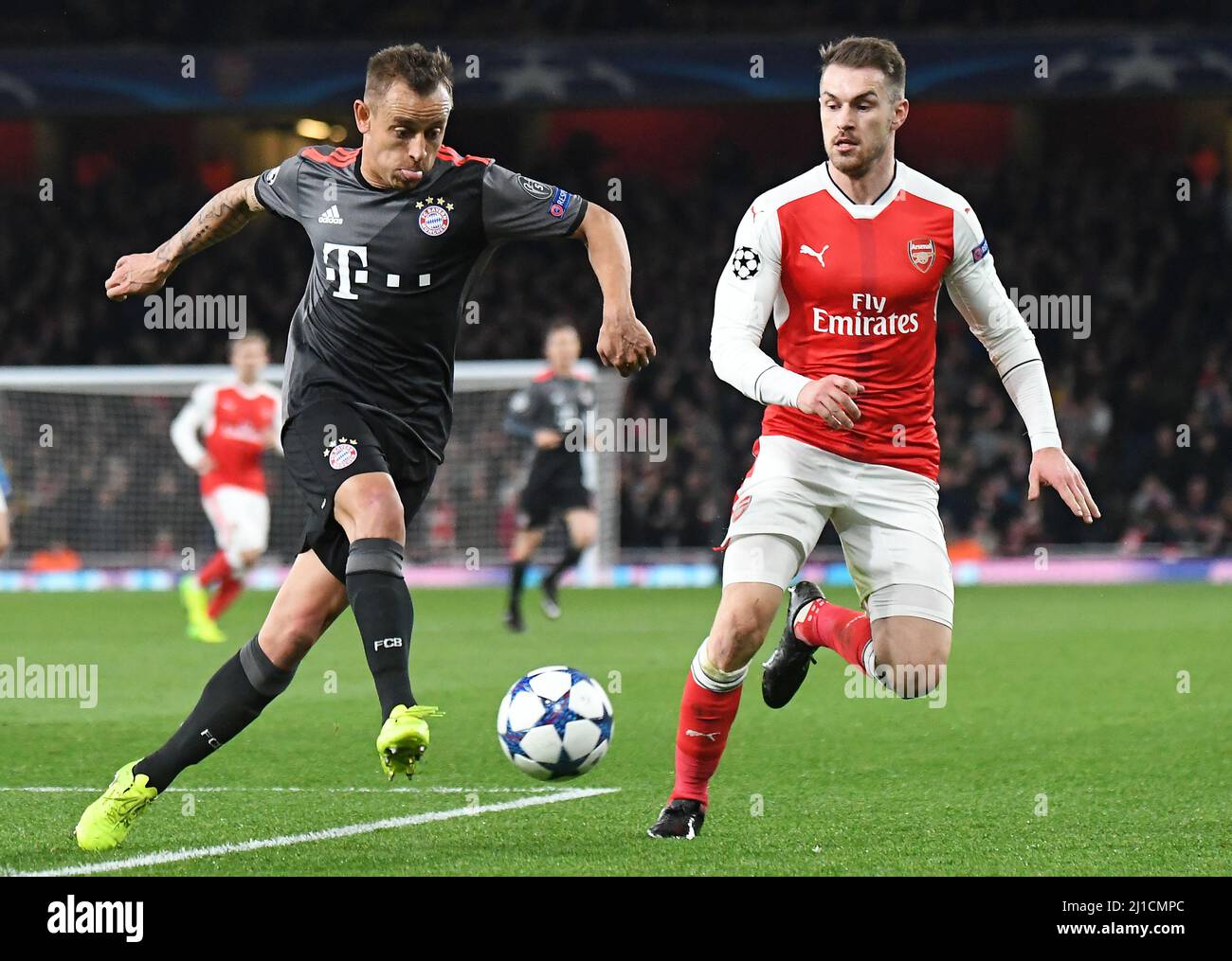 LONDON, ENGLAND - MARCH 7, 2017: Rafinha (L) of Bayern and Aaron Ramsey (R) of Arsenal pictured in action during the second leg of the UEFA Champions League Round of 16 game between Arsenal FC and Bayern Munchen at Emirates Stadium. Copyright: Cosmin Iftode/Picstaff Stock Photo