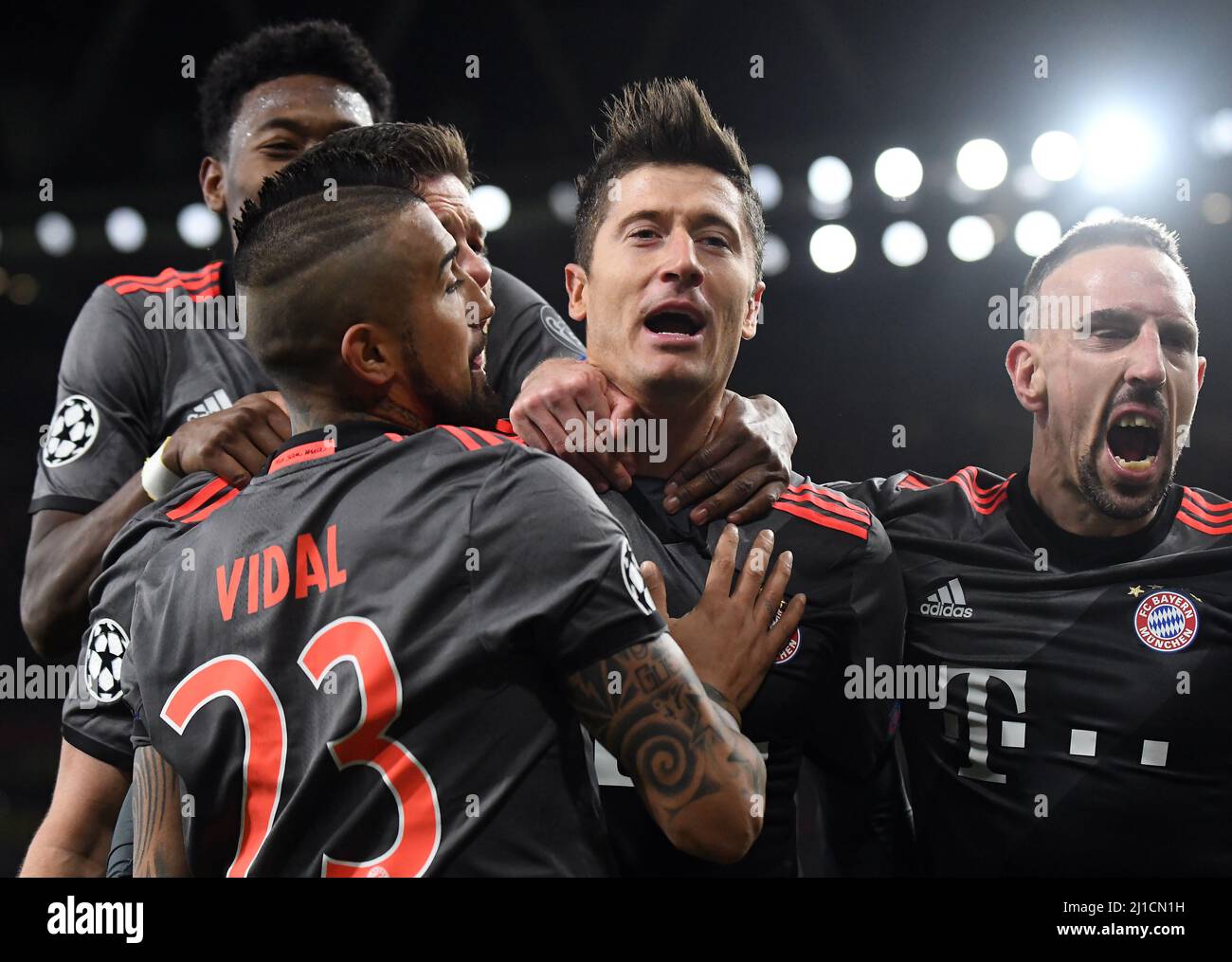 LONDON, ENGLAND - MARCH 7, 2017: Arturo Vidal (L), Franck Ribery (L) celebrate with Robert Lewandowski (C) after he scored a goal during the second leg of the UEFA Champions League Round of 16 game between Arsenal FC and Bayern Munchen at Emirates Stadium. Copyright: Cosmin Iftode/Picstaff Stock Photo
