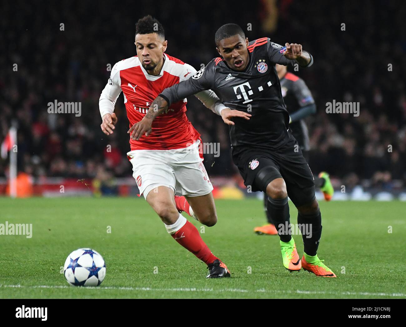LONDON, ENGLAND - MARCH 7, 2017: Francis Coquelin (L) of Arsenal and Douglas Costa (R) of Bayern pictured in action during the second leg of the UEFA Champions League Round of 16 game between Arsenal FC and Bayern Munchen at Emirates Stadium. Copyright: Cosmin Iftode/Picstaff Stock Photo