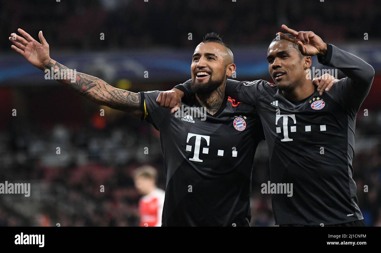 LONDON, ENGLAND - MARCH 7, 2017: Arturo Vidal of Bayern celebrates with Douglas Costa (R) after he scored a goal during the second leg of the UEFA Champions League Round of 16 game between Arsenal FC and Bayern Munchen at Emirates Stadium. Copyright: Cosmin Iftode/Picstaff Stock Photo