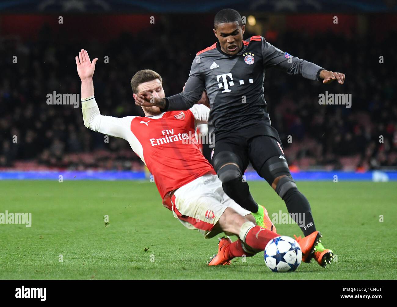LONDON, ENGLAND - MARCH 7, 2017: Shkodran Mustafi (L) of Arsenal and Arturo Vidal (R) of Bayern pictured in action during the second leg of the UEFA Champions League Round of 16 game between Arsenal FC and Bayern Munchen at Emirates Stadium. Copyright: Cosmin Iftode/Picstaff Stock Photo