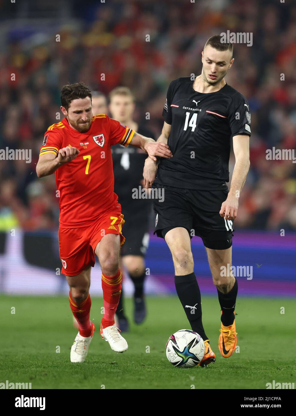 Cardiff, Wales, 24th March 2022.   Joe Allen of Wales tackles Julian Baumgartlinger of Austria during the FIFA World Cup 2023 Qualifying - European match at the Cardiff City Stadium, Cardiff. Picture credit should read: Darren Staples / Sportimage Stock Photo
