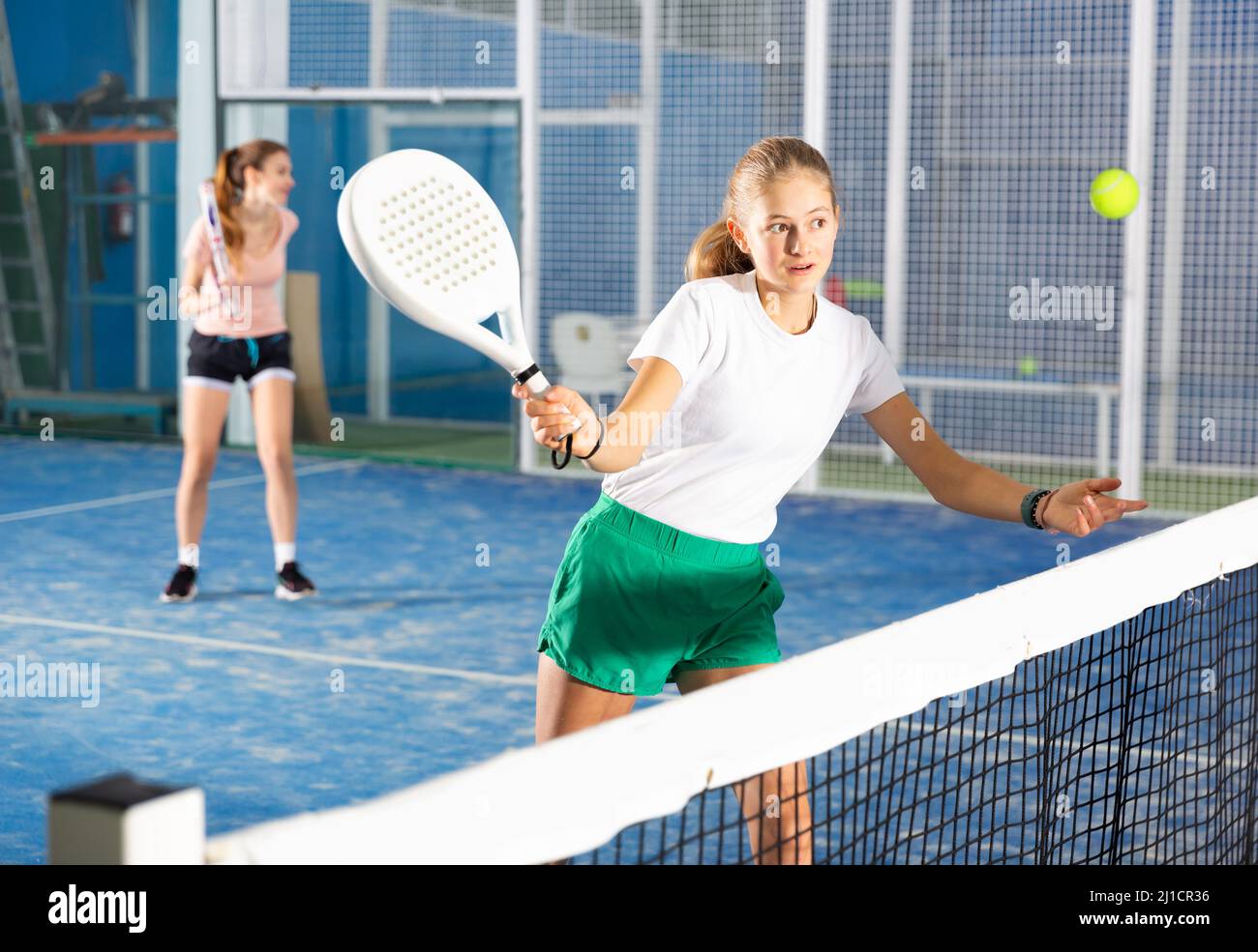 Girl tennis player playing padel tennis Stock Photo