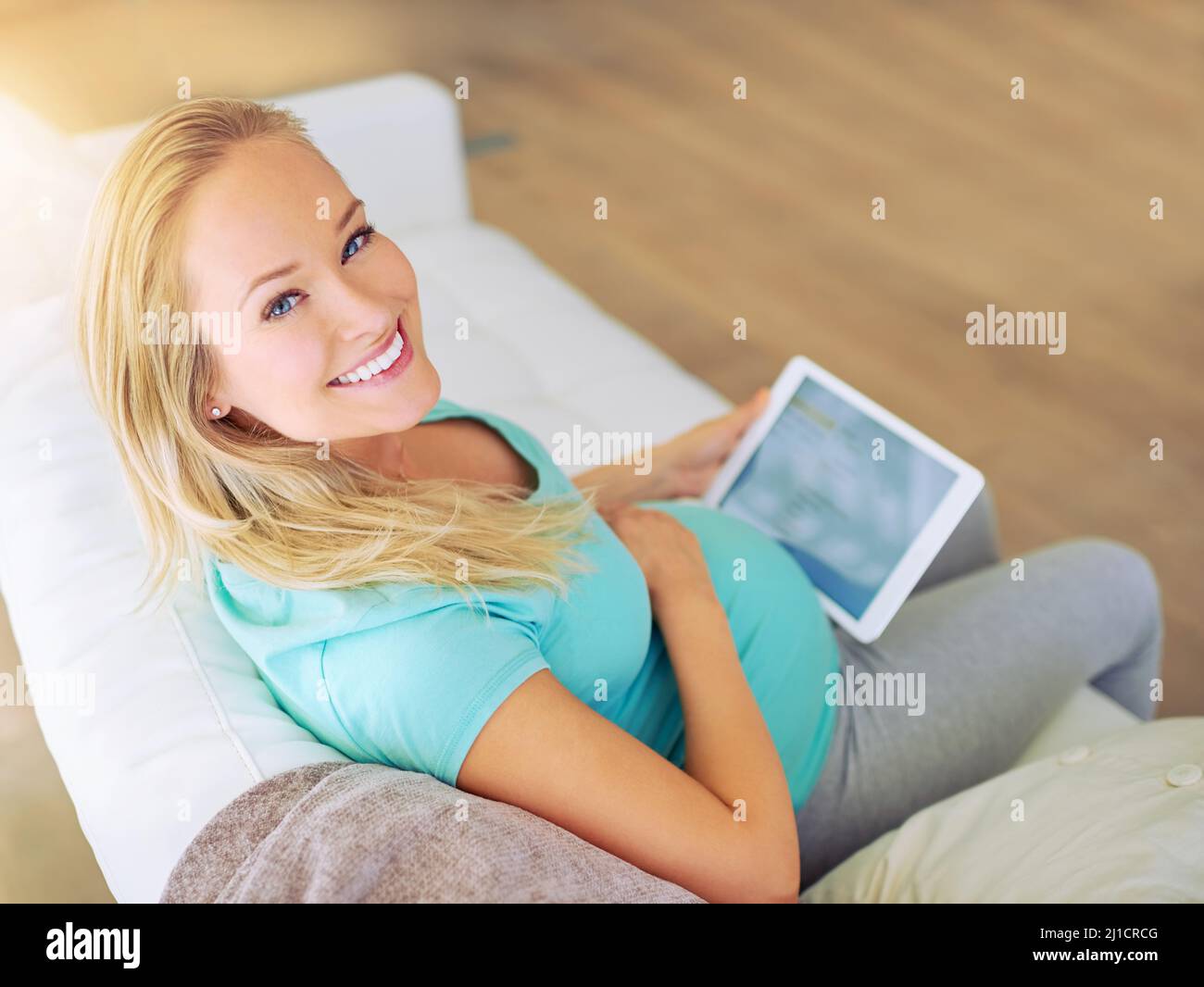 Carefree pregnant woman listening to music in city - a Royalty Free Stock  Photo from Photocase