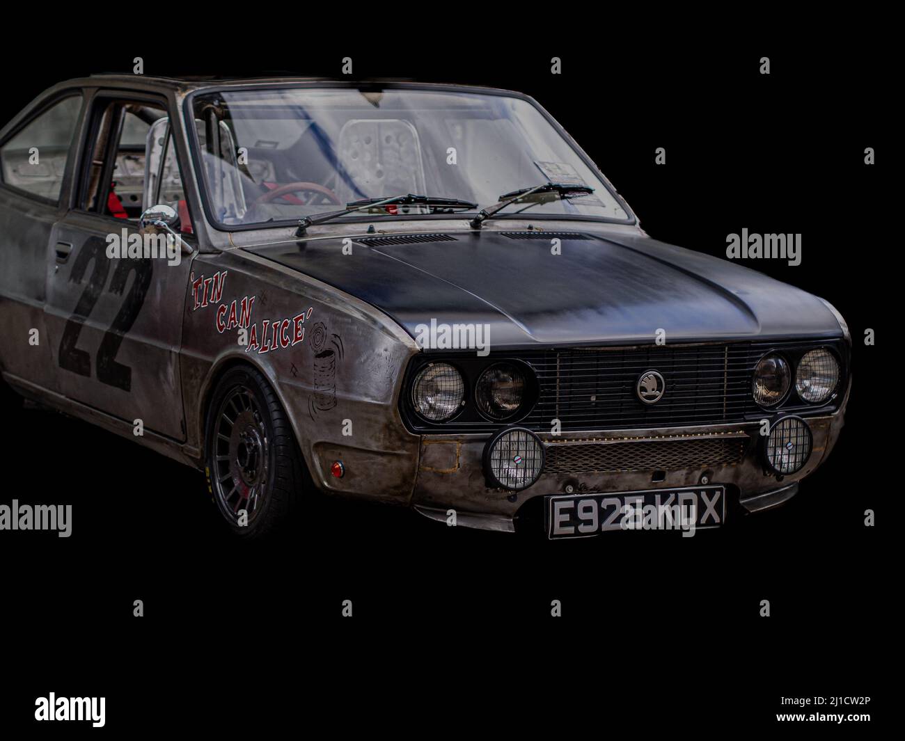 Retro racing car in the black background Stock Photo