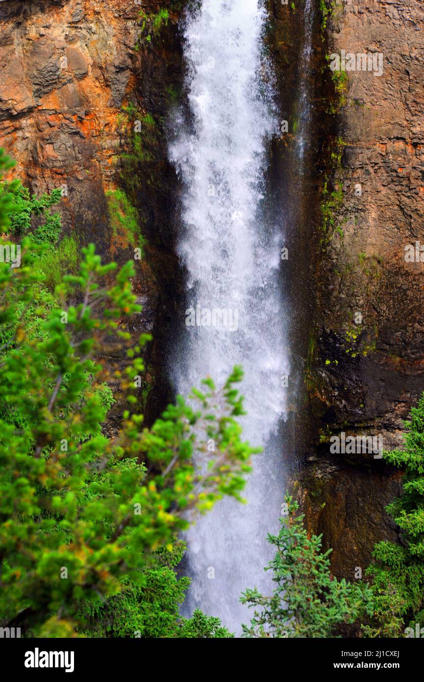 Closeup view of Tower Falls as it cascades down cliff face in Yellowstone National Park. Stock Photo
