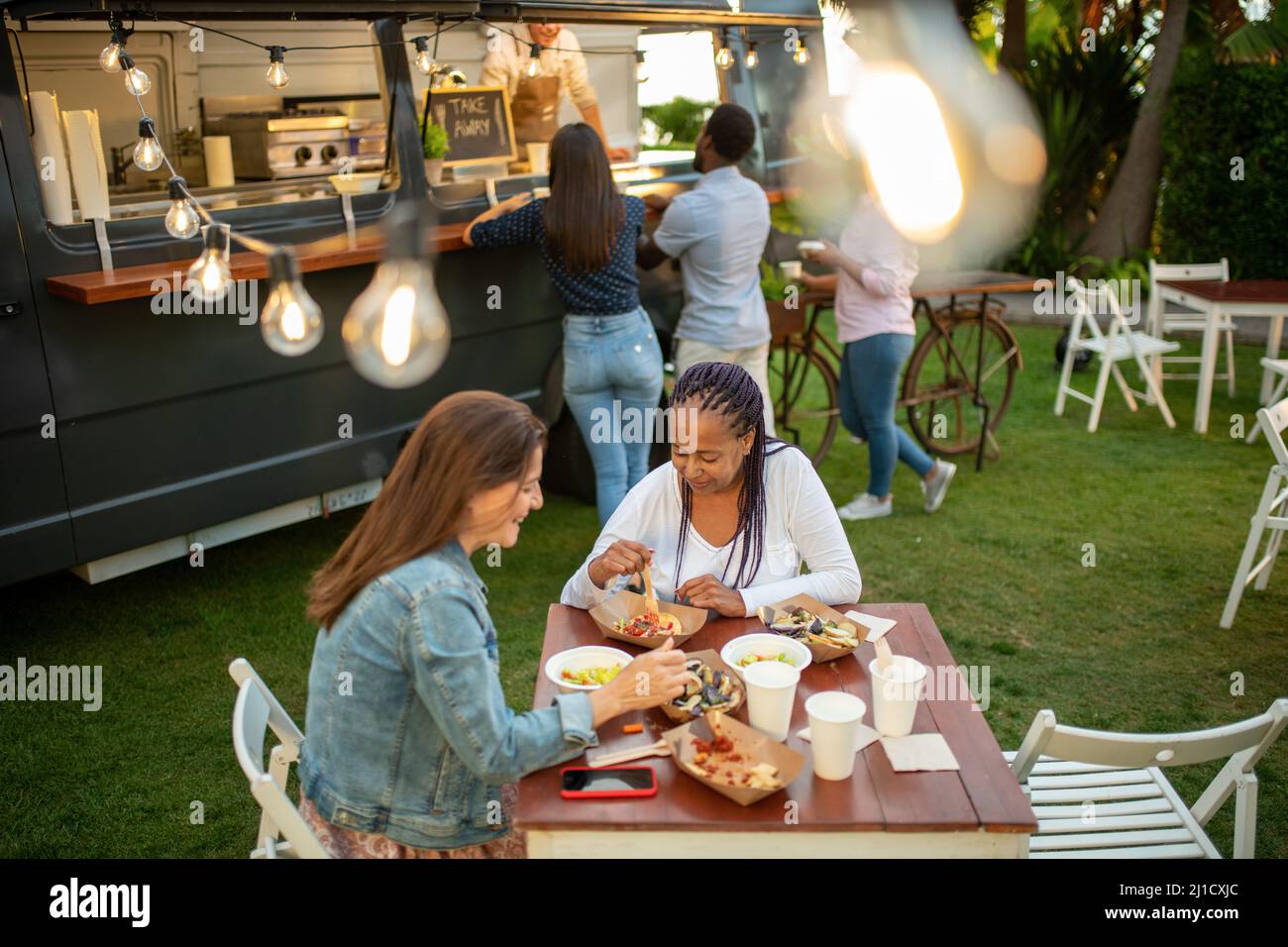 Group of friends having picnic Stock Photo