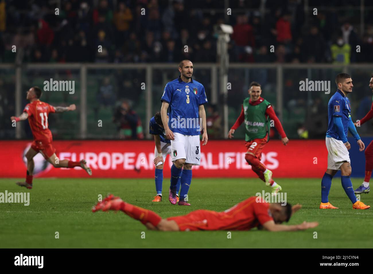 Palermo, Italy, 24th March 2022. Giorgio Chiellini of Italy reacts as North Macedonia players celebrate the 1-0 victory at the final whistle of the FIFA World Cup 2022 - European Qualifying match at Renzo Barbera Stadium, Palermo. Picture credit should read: Jonathan Moscrop / Sportimage Stock Photo