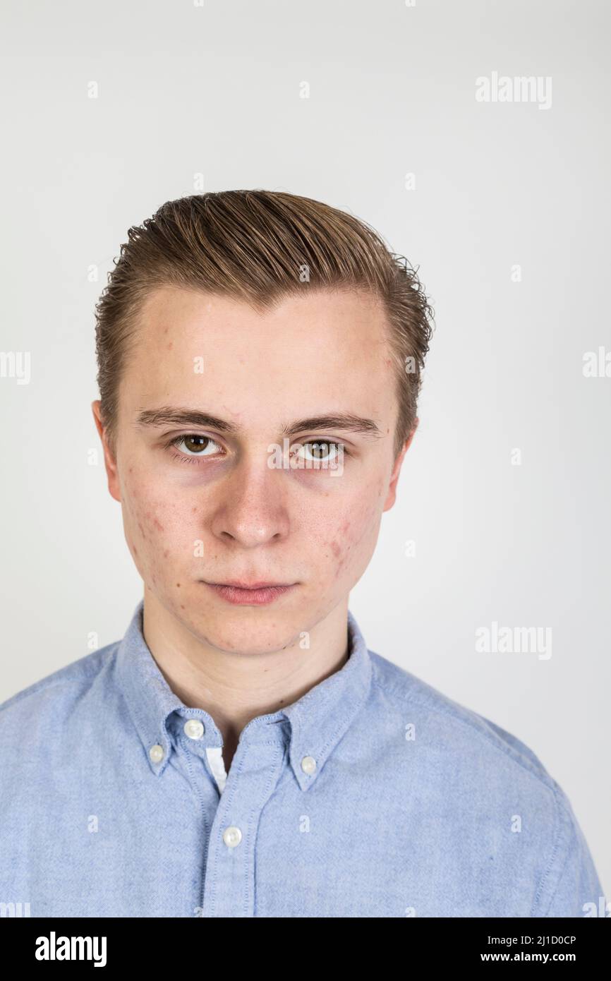 cool looking teenage boy is happy and confident Stock Photo Alamy