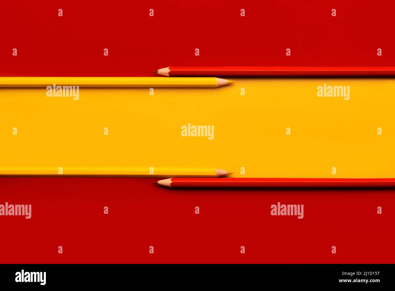 Spanish flag with yellow and red pencils with copy space Stock Photo
