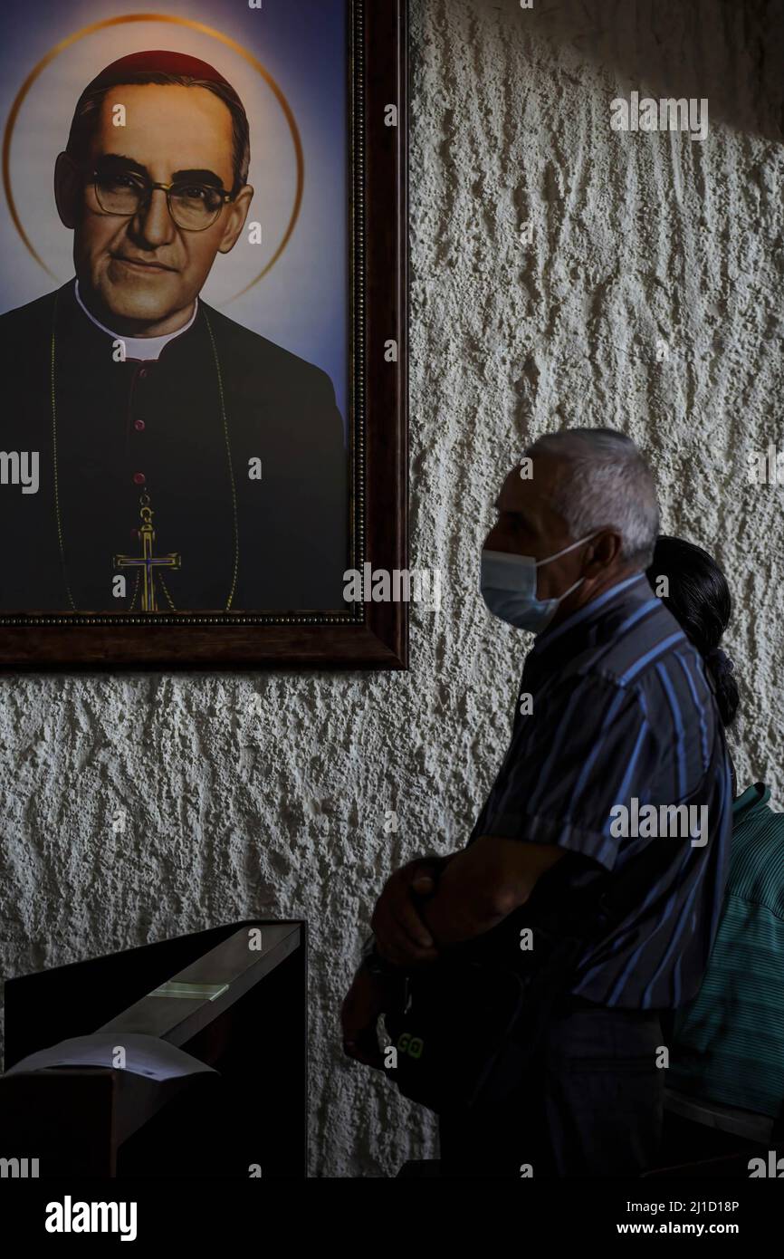 San Salvador, El Salvador. 24th Mar, 2022. A man prays next to an image ...