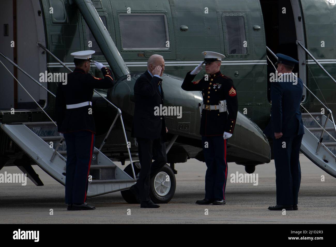 U.S. President Joe Biden disembarks Marine One and is met by U.S. Air Force Col. Matthew Jones commander, 89th Airlift Wing at Joint Base Andrews, Md., March 23, 2022, prior to boarding Air Force One for his trip to Europe. (U.S. Air Force photo by Staff Sgt. Jason Huddleston) Stock Photo