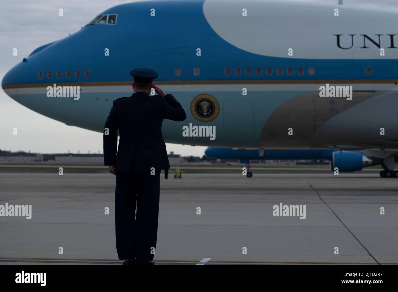 U.S. Air Force Col. Matthew Jones commander, 89th Airlift Wing salutes as Air Force One carrying U.S. President Joe Biden departs Joint Base Andrews, Md., March 23, 2022. (U.S. Air Force photo by Staff Sgt. Jason Huddleston) Stock Photo