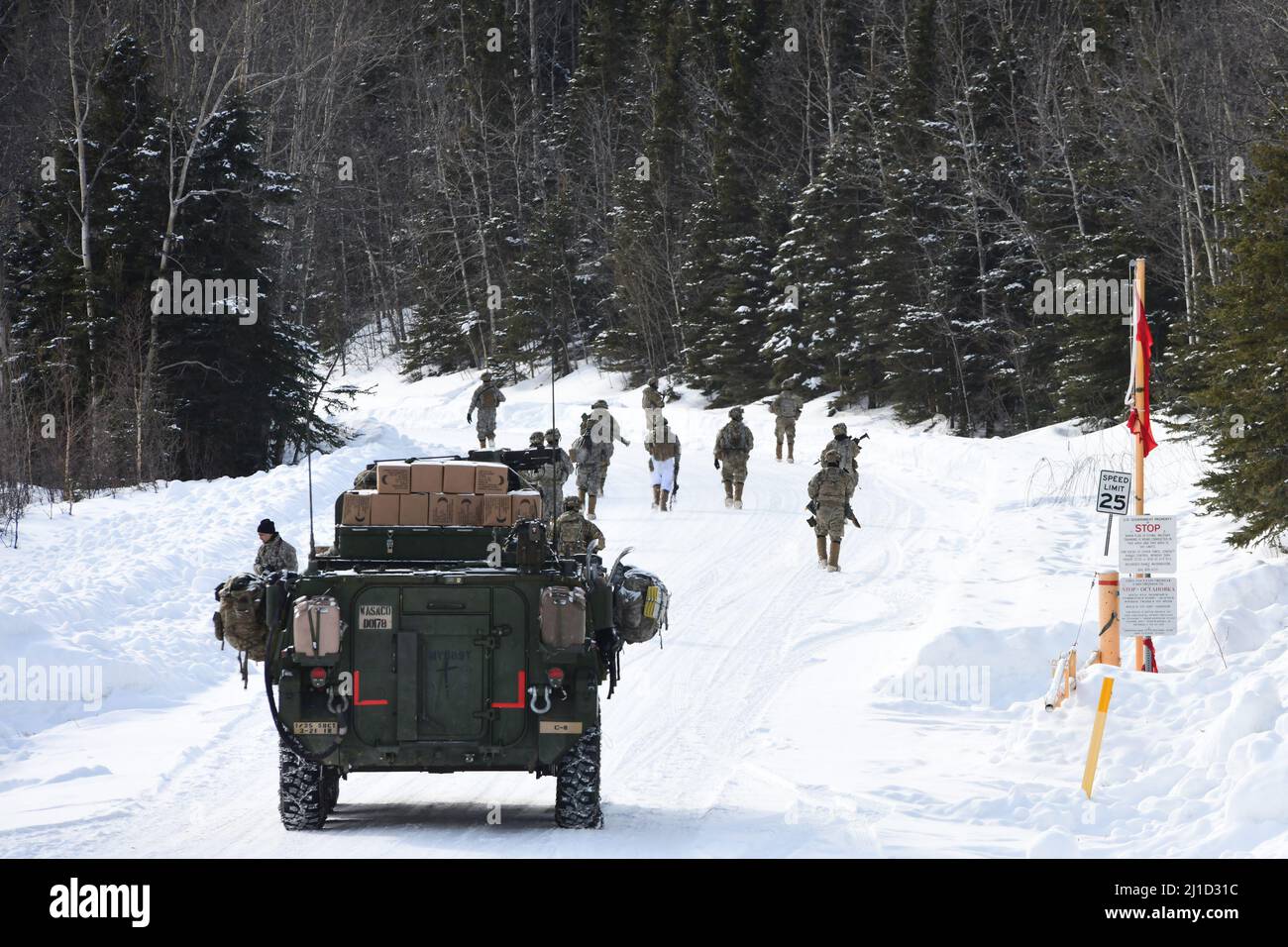 Dismounted infantrymen from the 3rd Battalion, 21st Infantry Regiment move to contact through the Donnelly Training Area during Joint Pacific Multinational Readiness Center 22-02, March 22, 2022. This exercise is designed to validate U.S. Army Alaska’s 1st Stryker Brigade Combat Team, 25th Infantry Division’s cold weather training, readiness and capabilities.  (Army photo/John Pennell) Stock Photo