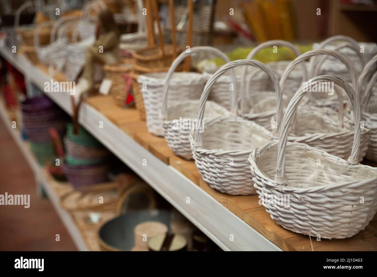 Wicker baskets on sale in store Stock Photo Alamy