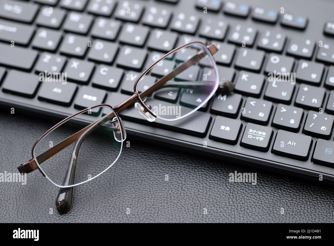 Stylish eyesight glasses with computer keyboard. Alphabetics and