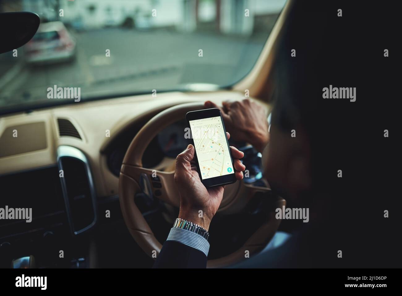 Getting there safely thanks to gps. Cropped shot of a businessman using