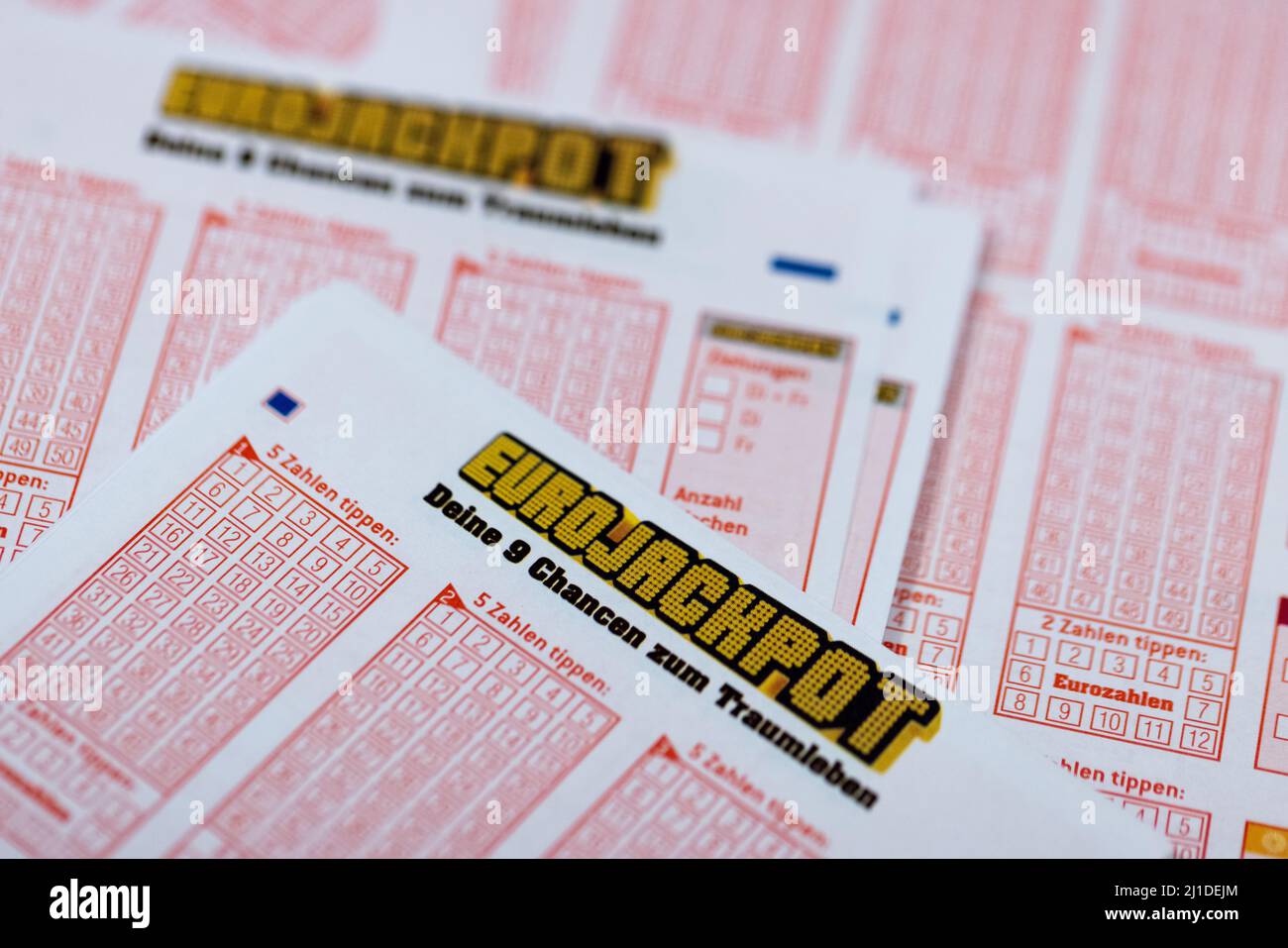 Cologne, Germany. 24th Mar, 2022. Lottery tickets with the inscription  "Euro Jackpot" are lying in a lottery retail outlet. The first draw with  new rules for the Eurojackpot takes place on March